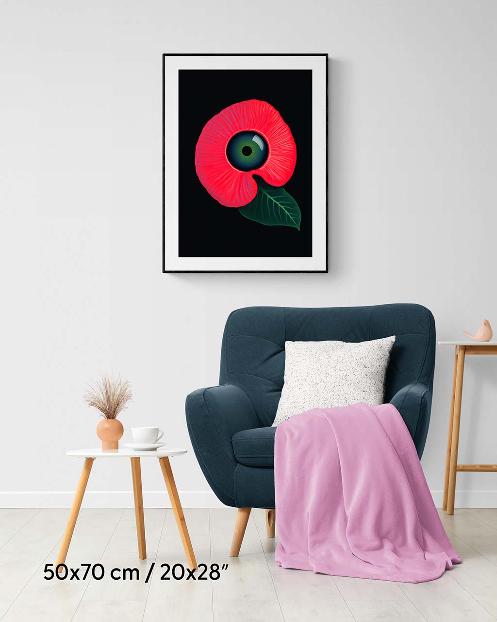 Framed poster on the wall. Poster features a surrealistic red flower with a green eye in the middle.