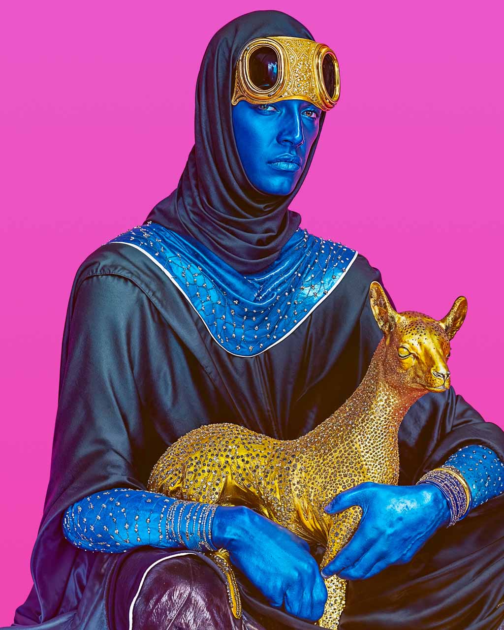 Surrealistic image of a blue man holding a golden lamb