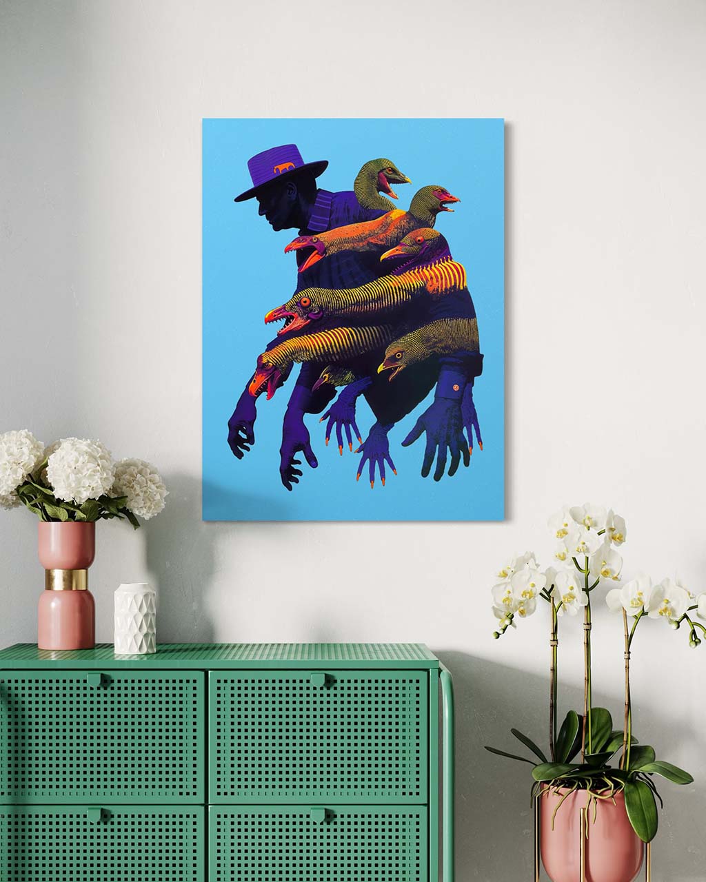 Artwork "Call of the Wild" displayed as a poster in a modern interior setting. The poster features a shadowy figure surrounded by colorful, bird-like creatures against a bold blue background. 